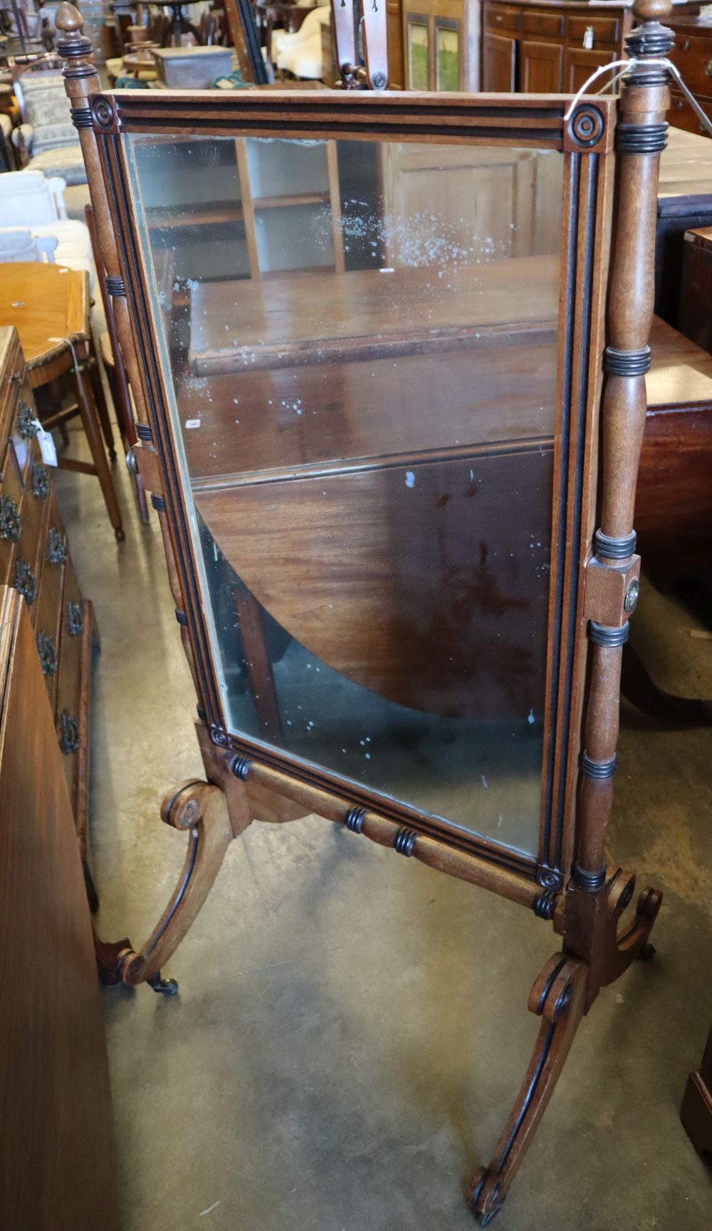 A Regency parcel ebonised mahogany cheval mirror, width 64cm height 134cm